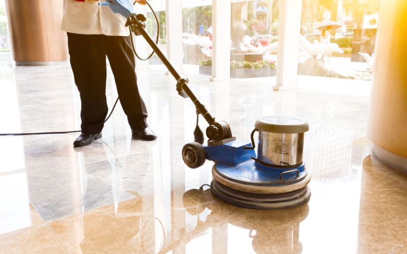 people polishes floor indoors