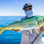 Angler,Is,Happy,With,The,Mahi-mahi,On,The,Blue,Sea.